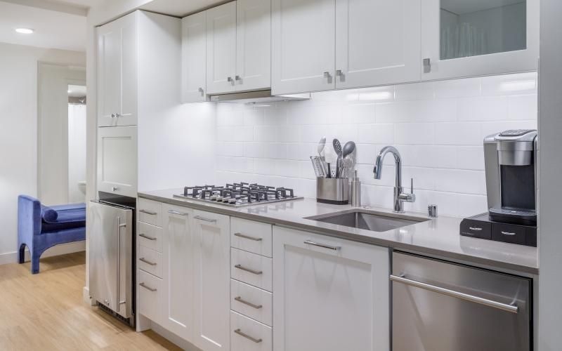 a kitchen with white cabinets