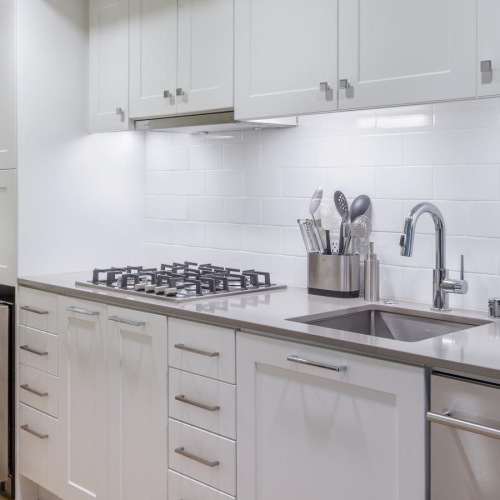 Spacious kitchens with thoughtful details a kitchen with white cabinets