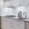 a kitchen with white cabinets