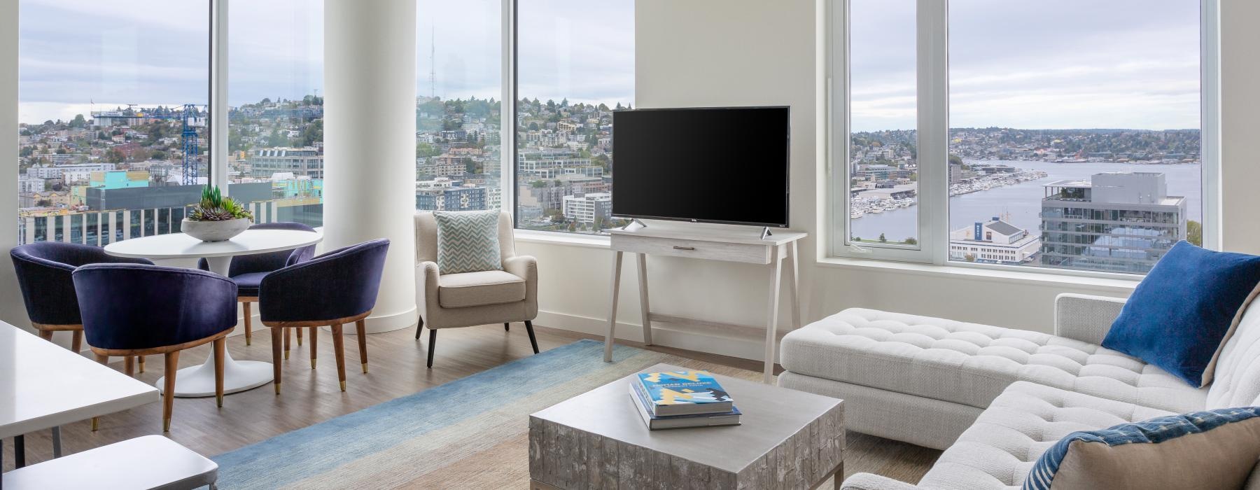 a living room with a tv and couches