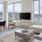 a living room with a tv and couches